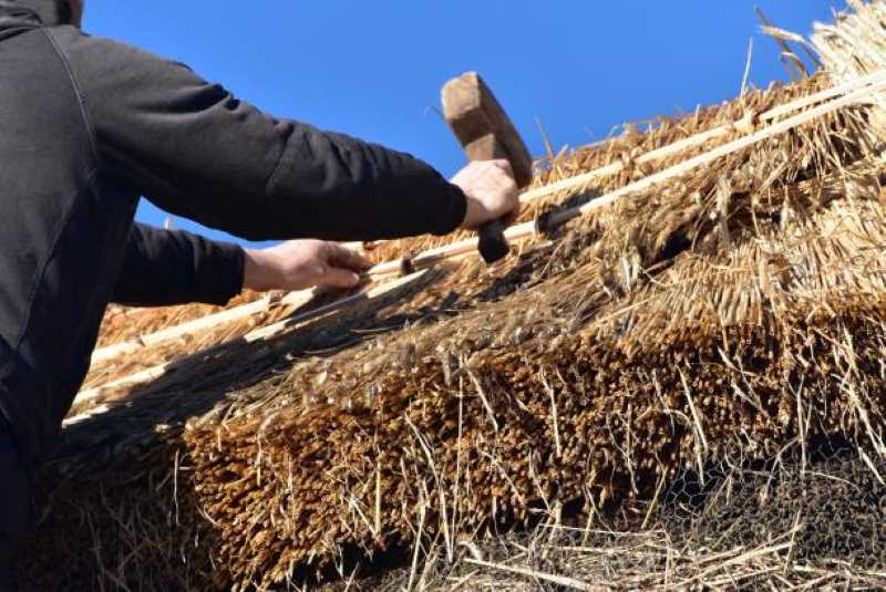 thatch roofing being installed